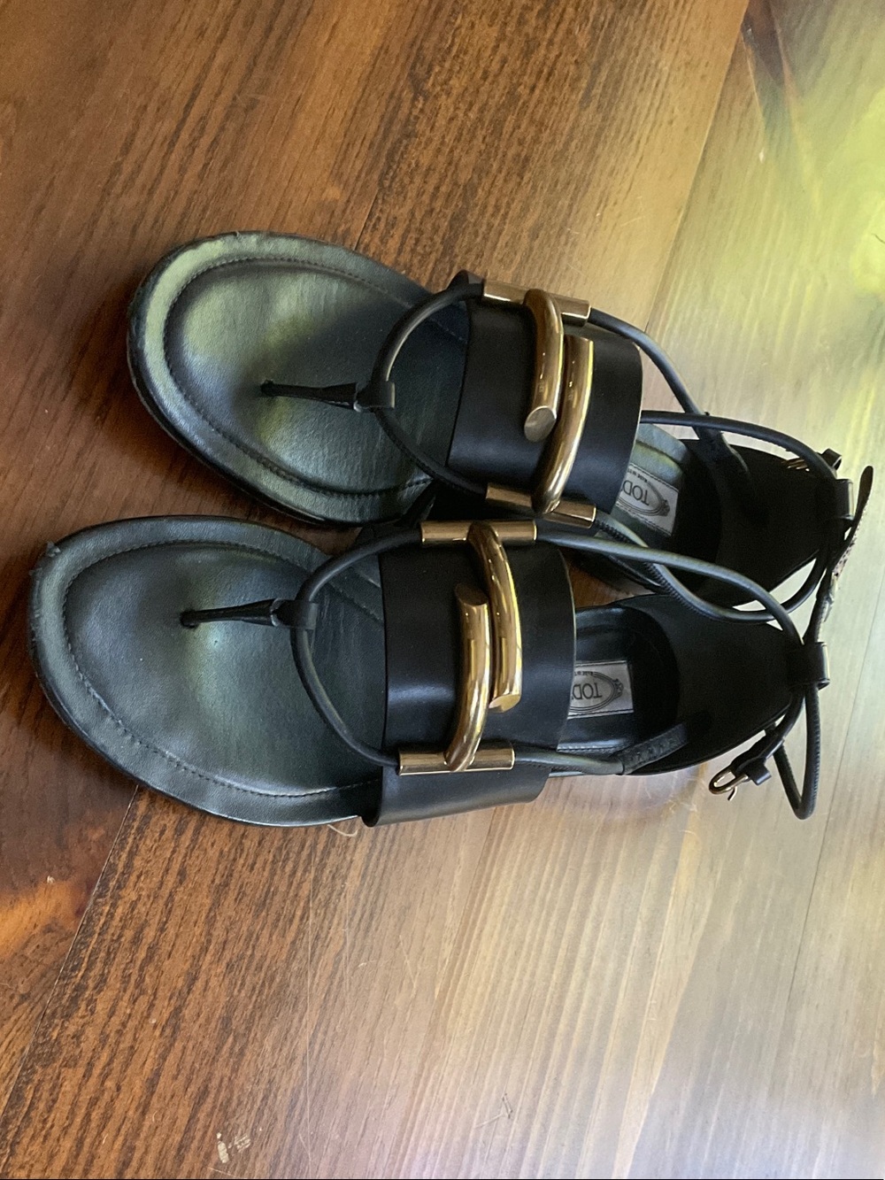Tod's Black Leather Toe-Post Sandals with Gold-Tone Buckle Detail
